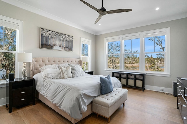 bedroom with light wood-style flooring, multiple windows, recessed lighting, and baseboards