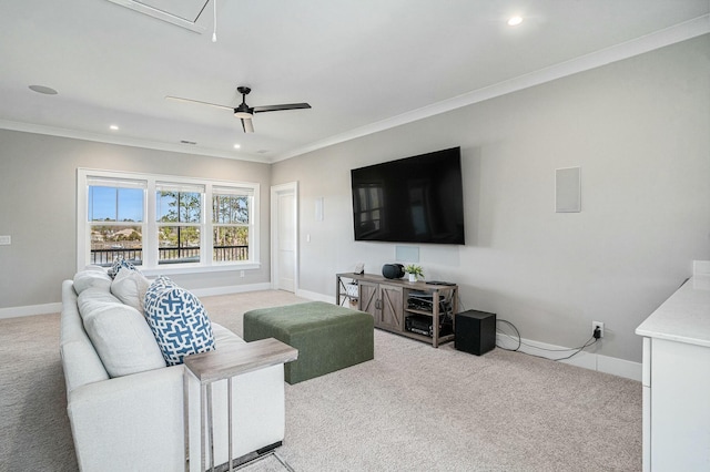 living room with light colored carpet, crown molding, and baseboards