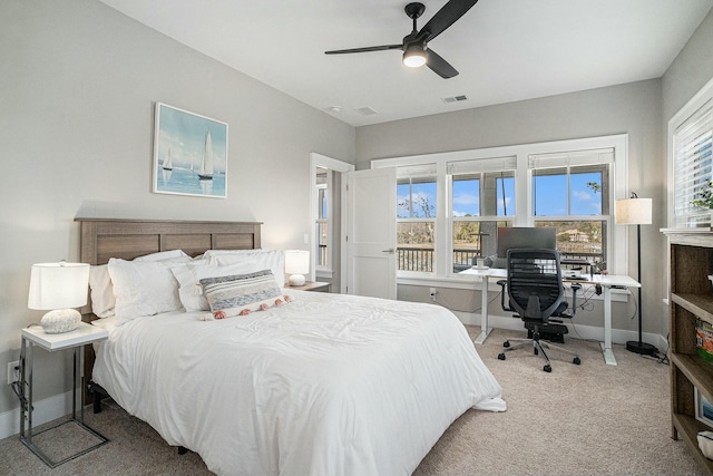 bedroom featuring a ceiling fan, carpet, visible vents, and baseboards