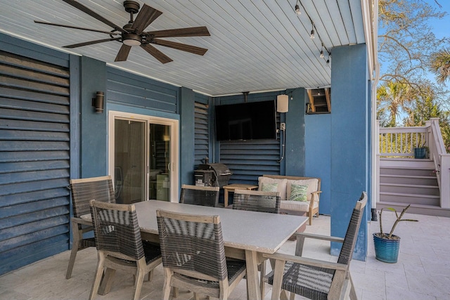 view of patio / terrace with outdoor dining space and a ceiling fan