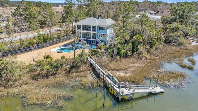 birds eye view of property with a water view