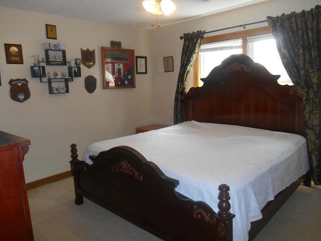 carpeted bedroom with baseboards