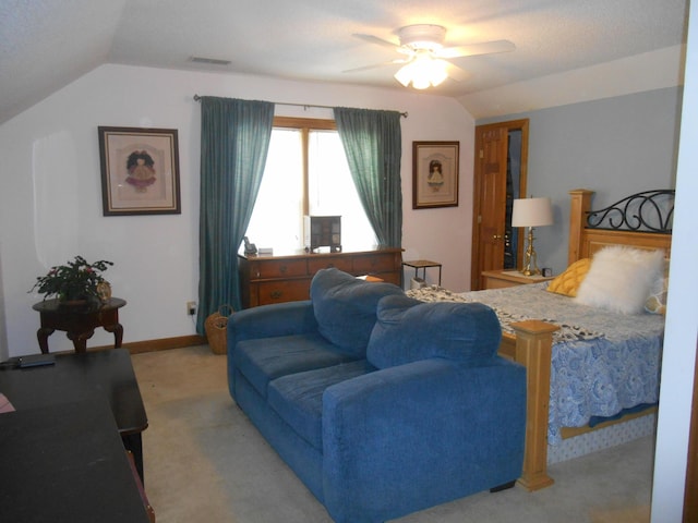 carpeted living room featuring lofted ceiling, baseboards, visible vents, and ceiling fan