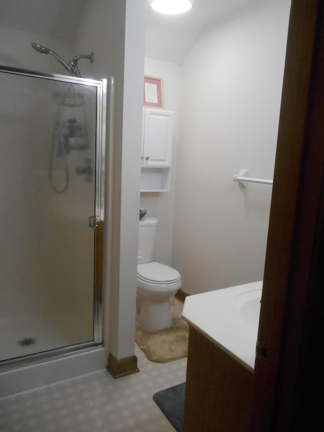 full bathroom with tile patterned floors, toilet, a stall shower, and vanity