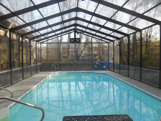 pool featuring a lanai and a patio area