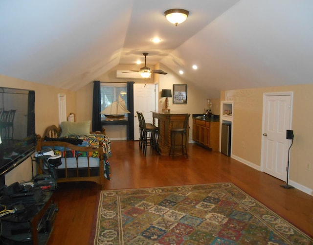 additional living space featuring dark wood-style floors, a ceiling fan, baseboards, and vaulted ceiling