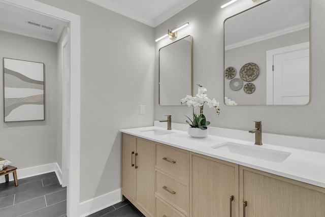 bathroom featuring double vanity, ornamental molding, visible vents, and a sink