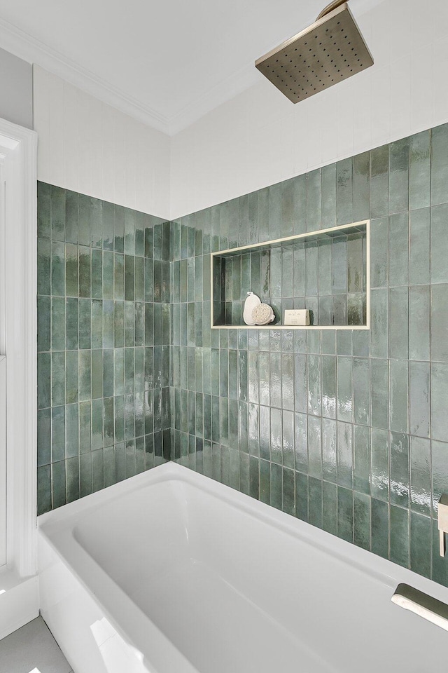 full bath featuring walk in shower, tile walls, a tub to relax in, and ornamental molding