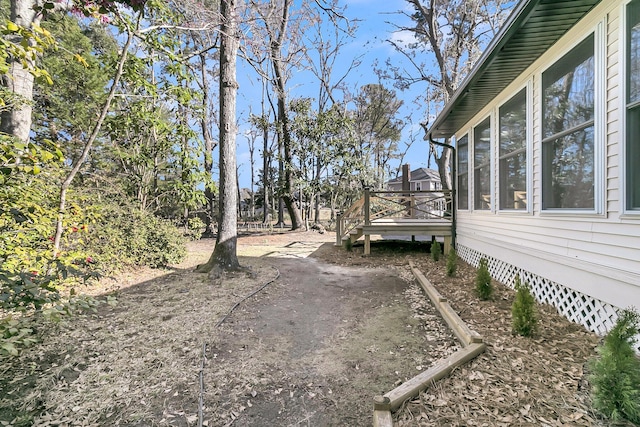 view of yard featuring a wooden deck