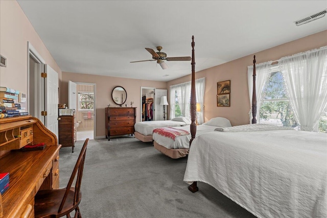 19 Cameroon Dr, Beaufort, SC 29907 - carpeted bedroom with a spacious closet, connected bathroom, a closet, and a ceiling fan