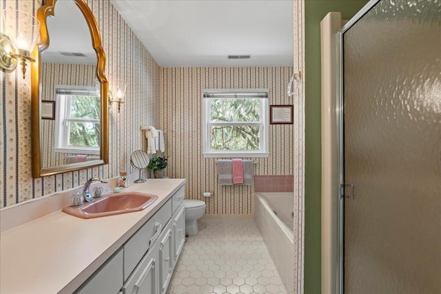 19 Cameroon Dr, Beaufort, SC 29907 - bathroom with wallpapered walls, plenty of natural light, vanity, a tub to relax in, and tile patterned flooring