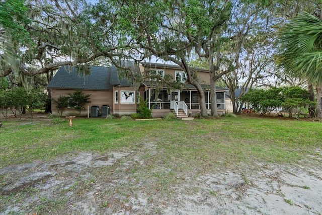 19 Cameroon Dr, Beaufort, SC 29907 - rear view of property with a sunroom, a yard, and roof with shingles