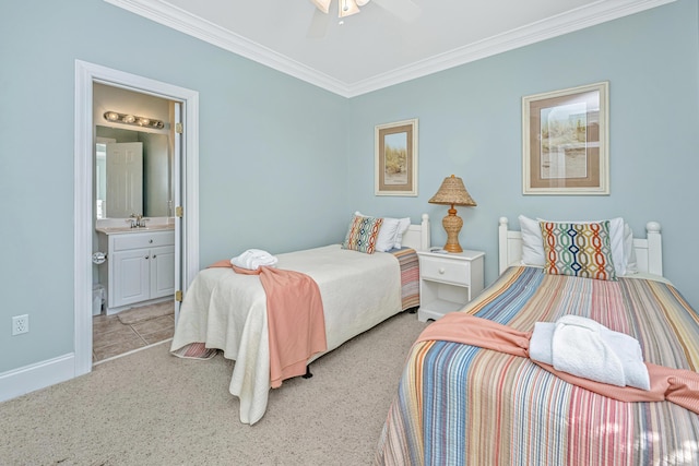 carpeted bedroom with ceiling fan, crown molding, ensuite bathroom, and sink