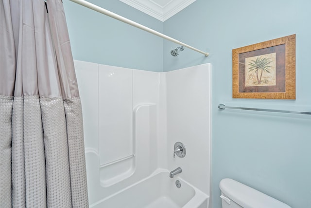 bathroom with crown molding, shower / tub combo with curtain, and toilet