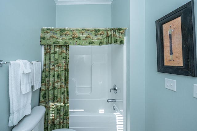 bathroom with toilet, shower / bath combo with shower curtain, and crown molding