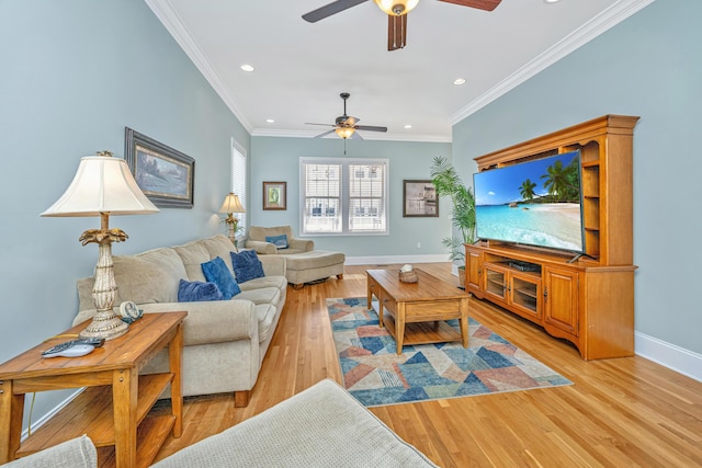 living room with light wood-type flooring, ceiling fan, and crown molding