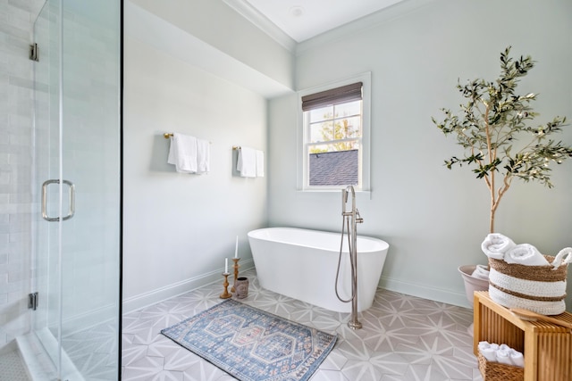 bathroom with a stall shower, a soaking tub, tile patterned floors, baseboards, and ornamental molding