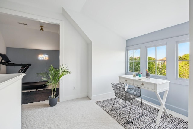 office space with vaulted ceiling, carpet flooring, and baseboards