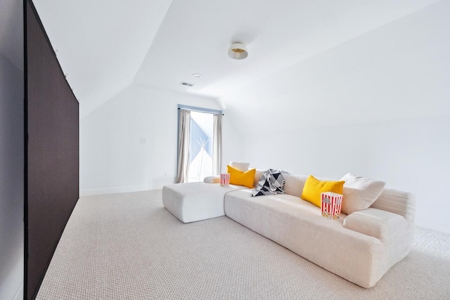 living area with lofted ceiling and carpet flooring