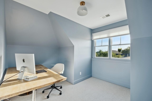 carpeted home office featuring baseboards