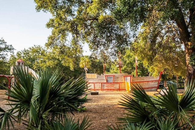 view of yard with view of wooded area