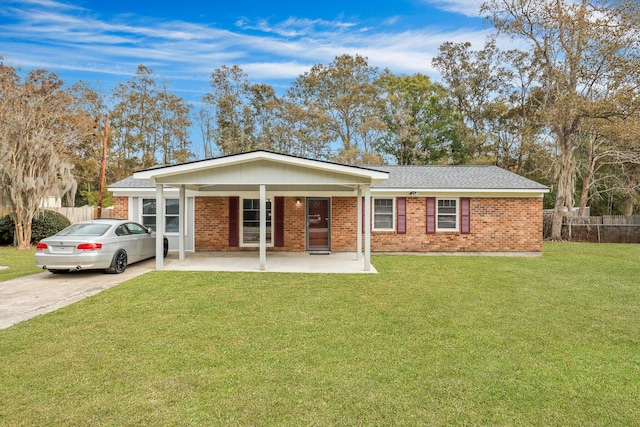 ranch-style home featuring a front yard