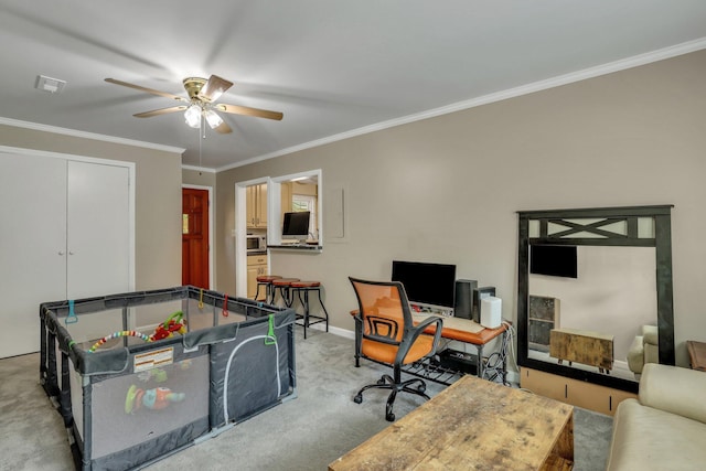 interior space featuring ceiling fan, light colored carpet, and crown molding