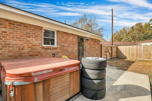 view of patio / terrace featuring a hot tub