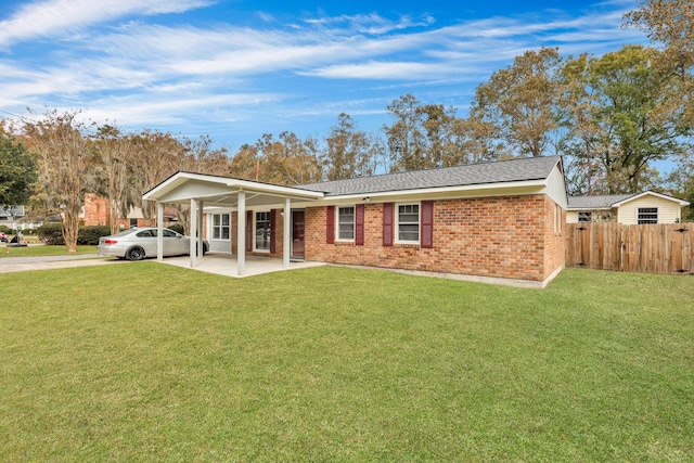 view of front of property featuring a patio area and a front lawn