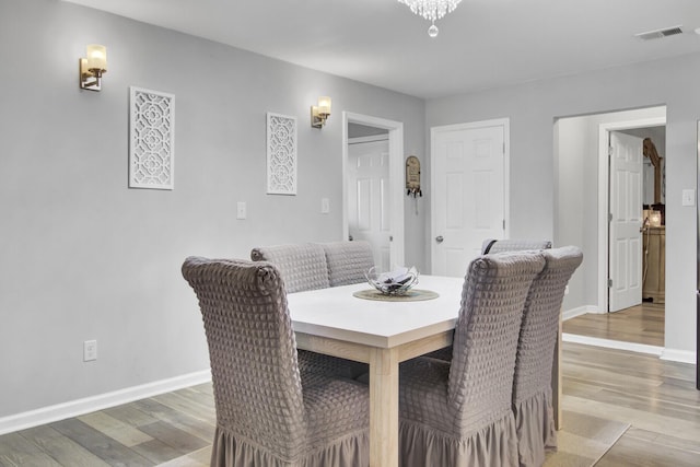 dining area featuring wood-type flooring