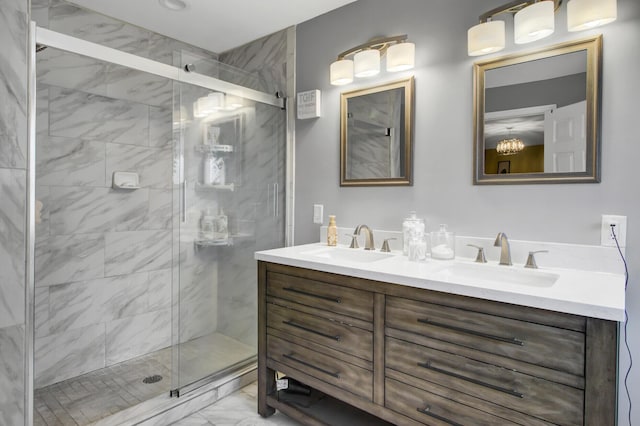 bathroom with vanity and a shower with shower door