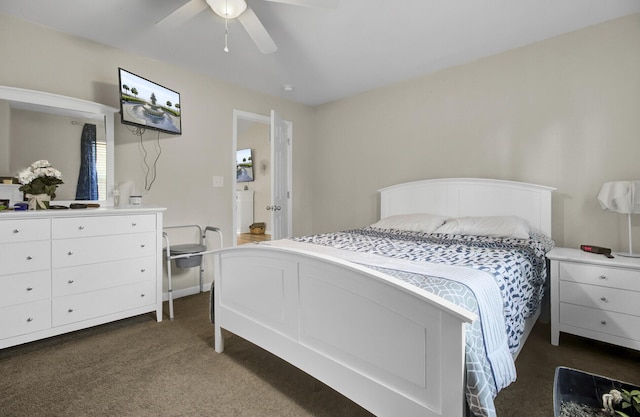 bedroom with ceiling fan and dark carpet