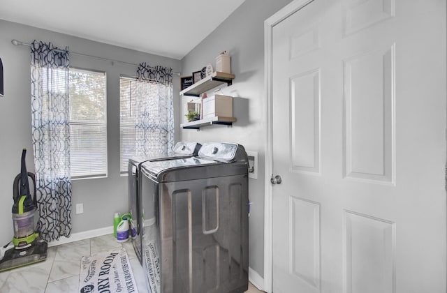 laundry area with separate washer and dryer