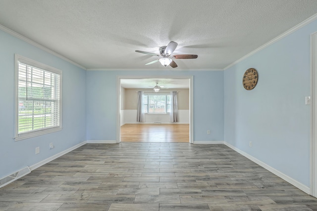 108 Reardon St, Moncks Corner, SC 29461 - spare room featuring ceiling fan, a textured ceiling, ornamental molding, and wood finished floors