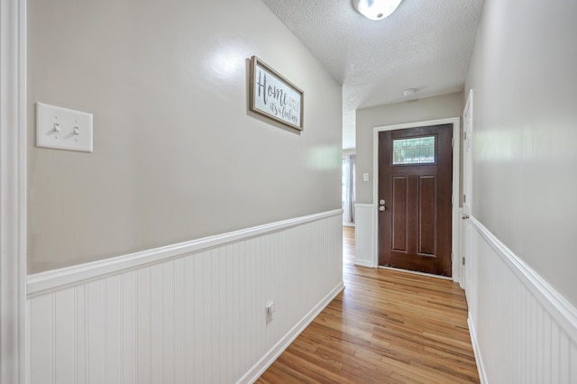 108 Reardon St, Moncks Corner, SC 29461 - entryway with wainscoting, light wood-type flooring, and a textured ceiling