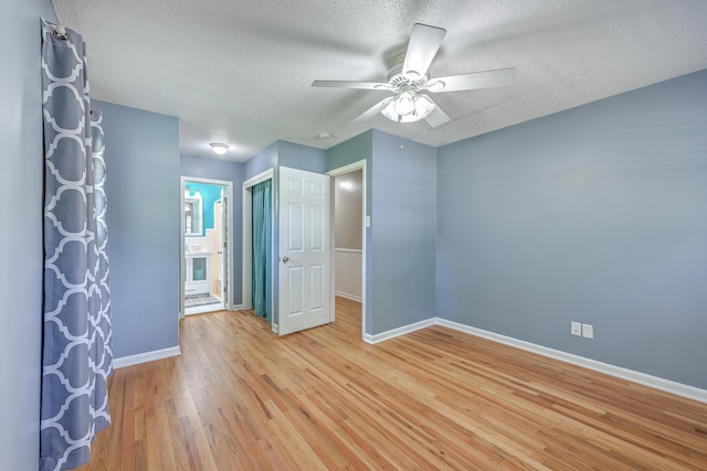 108 Reardon St, Moncks Corner, SC 29461 - unfurnished bedroom with light wood finished floors, a textured ceiling, ensuite bathroom, and ceiling fan