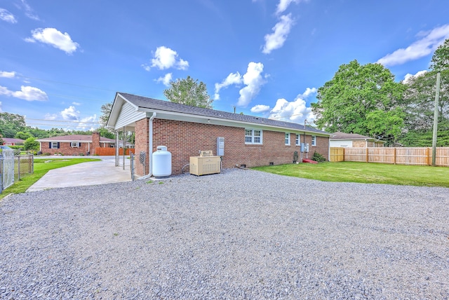 108 Reardon St, Moncks Corner, SC 29461 - rear view of house featuring gravel driveway, brick siding, a patio area, and crawl space