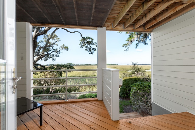 wooden terrace featuring a rural view