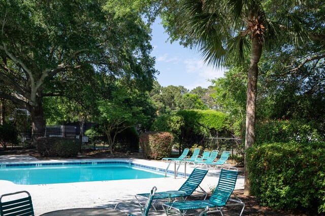 1712 Live Oak Park, Seabrook Island, SC 29455 - community pool with a patio area and view of scattered trees