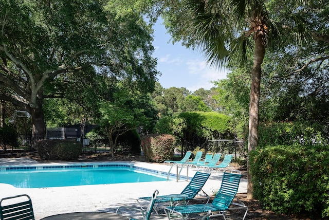 1712 Live Oak Park, Seabrook Island, SC 29455 - community pool featuring a patio and view of scattered trees
