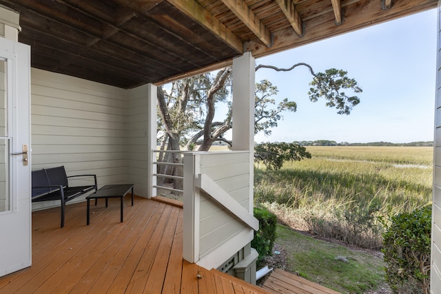 wooden deck featuring a rural view