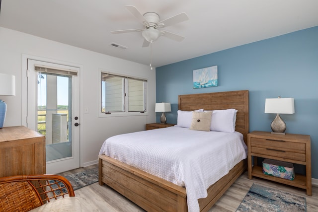 bedroom with ceiling fan, light wood-type flooring, and access to exterior