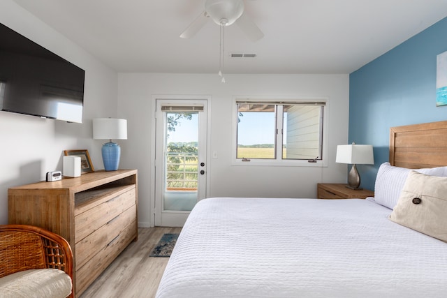 bedroom featuring light wood-type flooring, ceiling fan, and access to exterior