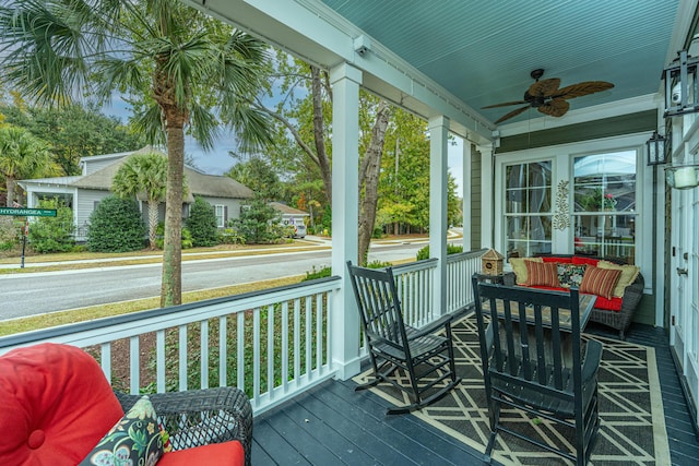 sunroom featuring ceiling fan and a wealth of natural light