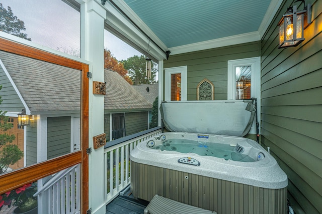 wooden terrace with a hot tub