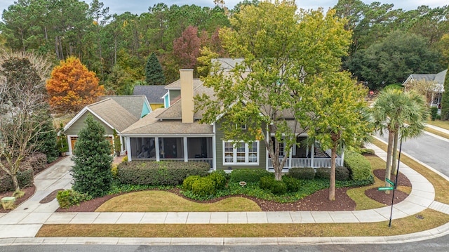 view of front facade with a sunroom