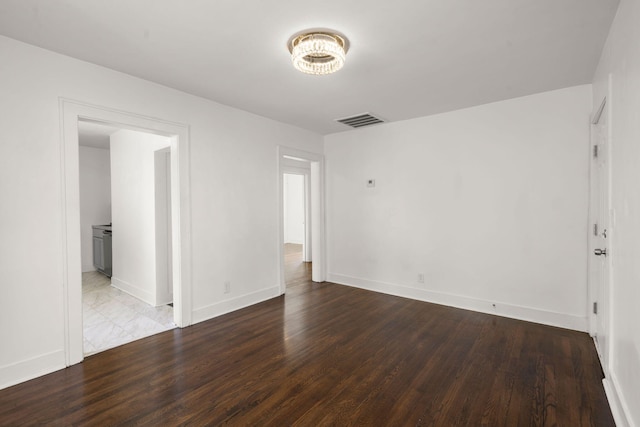 empty room featuring hardwood / wood-style flooring