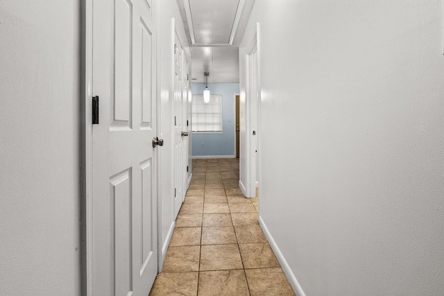 7914 Dutch Ct, North Charleston, SC 29420 - hallway with attic access, light tile patterned floors, and baseboards
