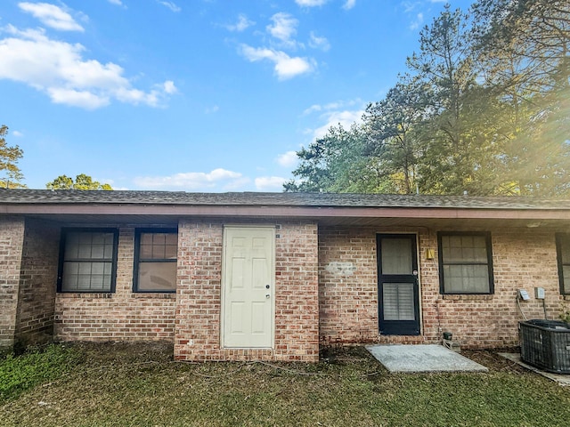 7914 Dutch Ct, North Charleston, SC 29420 - rear view of property featuring brick siding and central air condition unit