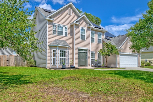 9682 Pebble Creek Blvd, Summerville, SC 29485 - view of front of house with roof mounted solar panels, an attached garage, and concrete driveway
